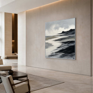 Large textured coastal wall art in a hotel lobby with a silver frame.