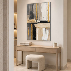 Neutral abstract painting above a light wood dressing console with a cream stool.