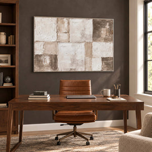 Time in Soft Focus in a silver frame above a wood desk and tan office chair against a brown wall.
