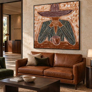 Time to Linger in a black frame above a brown leather sofa and dark wood table near a reception area.