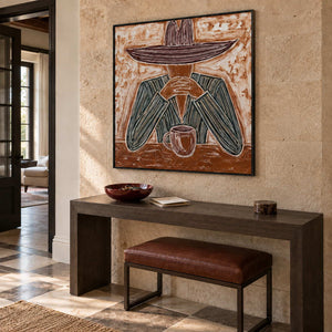Time to Linger in a black frame above a dark hallway console and a leather bench against a warm textured wall.
