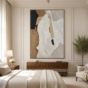 Wood framed white and sand abstract artwork above a dresser beside a softly furnished bed.
