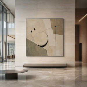 Two Circles Hold the Quiet in a silver-framed hotel lobby