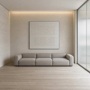 White textured minimalist wall art in a serene ivory living room.