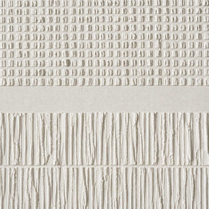 Close-up of repeated ivory imprints and vertical hand-painted ridges.