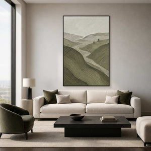 Textured green landscape wall art in a refined living room with a black frame.