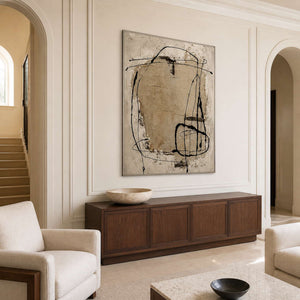 Silver-framed abstract wall art above a dark wooden entryway console.