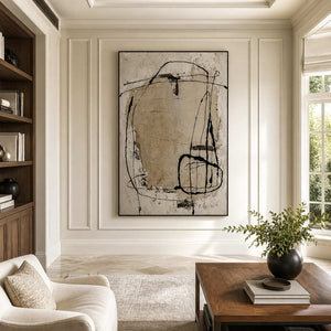 Black-framed abstract wall art displayed in a warm wood-paneled home library.