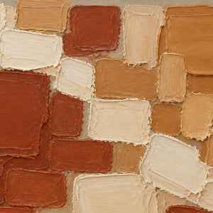 Close-up of the painted texture in terracotta, ochre, and cream painted blocks.