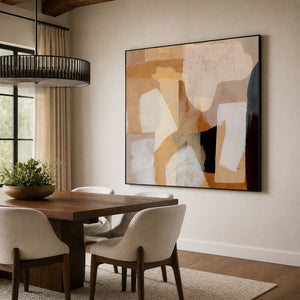 Layered ochre abstract artwork behind a dining table beneath a dark circular pendant.