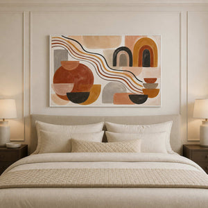 Ochre and rust abstract wall art styled above a neutral bed.