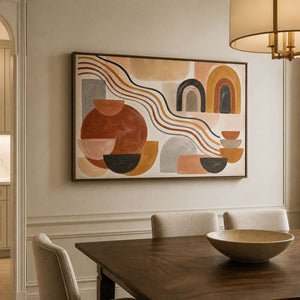 Warm geometric abstract wall art displayed above a wood dining table.