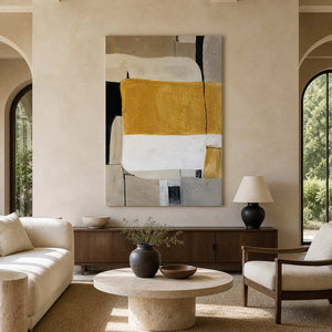 Ochre and cream abstract painting above a sideboard in an airy living room.