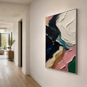 Black and ivory impasto painting anchors a light contemporary hallway.