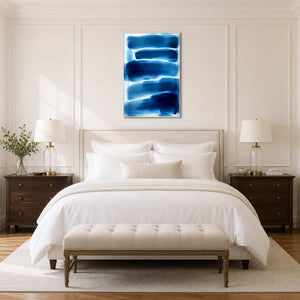 Cobalt and white minimalist canvas above a serene ivory bedroom.