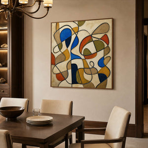 Colorful textured abstract wall art displayed above a refined dining table.