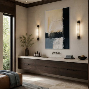 Where Day Meets Night in a white frame above a long wood bathroom vanity between two vertical wall lights.