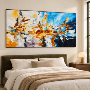 Wide gestural artwork above a dark green upholstered bed.