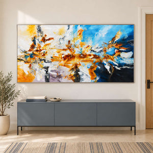 Wide colorful artwork above a gray sideboard near the entry.