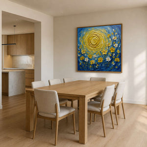 Blue and yellow floral artwork displayed above a light wood dining room.