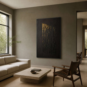 Black and gold wall art displayed in an olive-gray family living room.