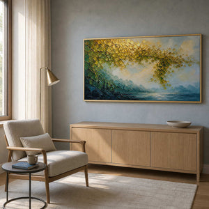 Textured landscape canvas styled beside a sunlit reading chair.