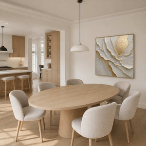 Textured floral artwork displayed above a warm white dining room.