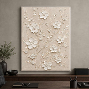 White floral relief painting displayed in an executive office.