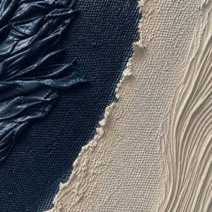 Close-up of folded midnight paint fine ivory ridges and rough texture.