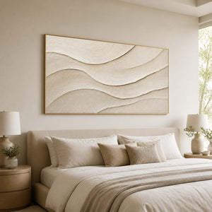 Soft beige and white textured artwork displayed in a restful luxury bedroom.