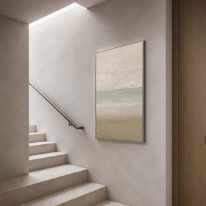Tall coastal artwork viewed beside a pale minimalist staircase.