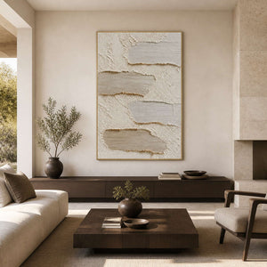 Textured neutral abstract wall art displayed in a warm modern living room.