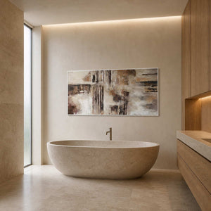Textured abstract wall art displayed in a warm stone bathroom.