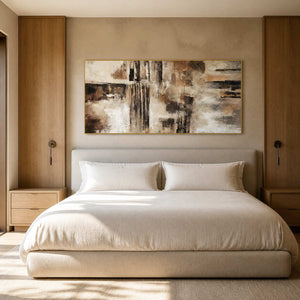 Textured abstract wall art above a quiet warm modern bedroom.