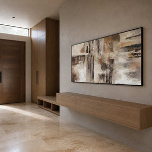 Textured abstract wall art displayed in a warm modern entryway.