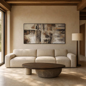 Textured abstract wall art displayed in a warm modern living room.