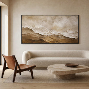 Neutral textured wall art above an organic modern living room.