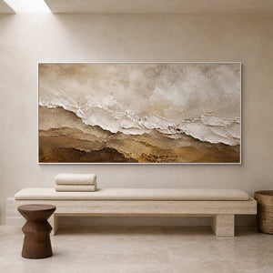 Mineral textured wall art above a travertine bench in a hotel spa.