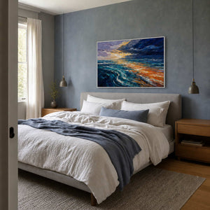 Turquoise and gold seascape wall art styled above a blue-gray bedroom.