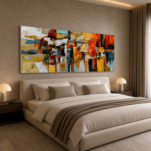 Orange and blue abstract wall art above a neutral bedroom.