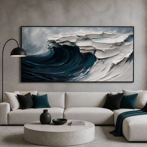 Dramatic textured ocean wall art displayed in a minimalist living room.