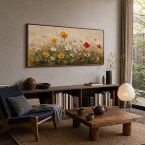 Warm floral wall art adding softness to a natural reading room.