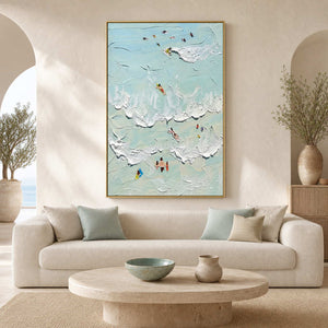 Sea-glass coastal wall art above a softly curved neutral living room sofa.