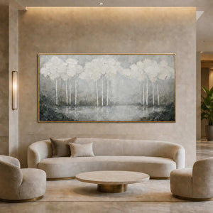 Textured landscape wall art displayed in a refined boutique hotel lobby.