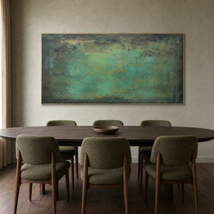 Verdigris green abstract painting in a mid-century modern dining room.