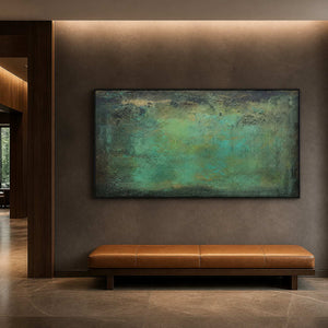 Green panoramic artwork above a leather bench in a hotel corridor.