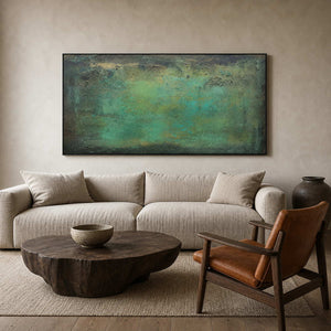 Green textured abstract wall art above an organic modern living room.