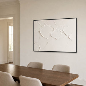 Minimalist white relief wall art displayed in a refined American dining room.