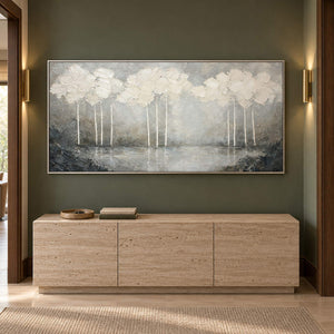 Hand-painted textured landscape wall art in white, pearl gray, and charcoal, displayed in a hallway in a silver frame.