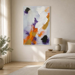 Vertical textured abstract wall art displayed in a softly lit neutral bedroom.